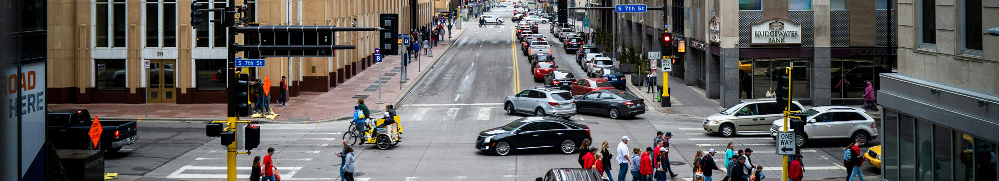 photo of traffic at a busy intersection on 7th Street in downtown Minneapolis